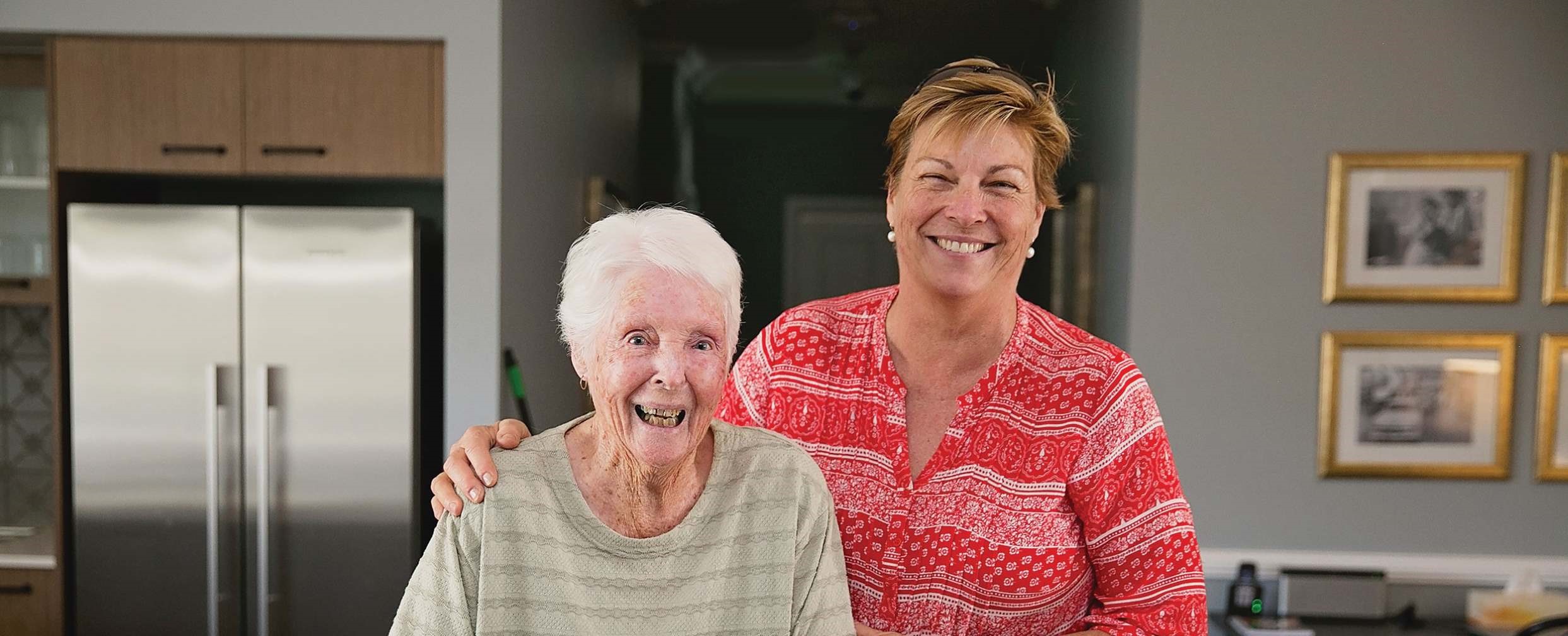 Two women standing together in a house | Featured Image for the Dementia Aged Care Page of NewDirection Care.